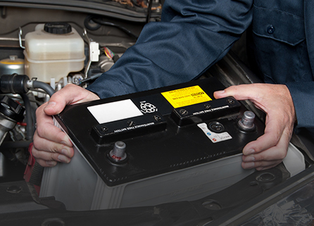 Mechanic replacing car battery in singapore
