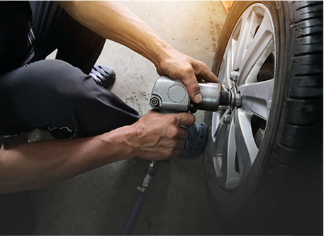 Professional Mechanic Replacing Car Tyre