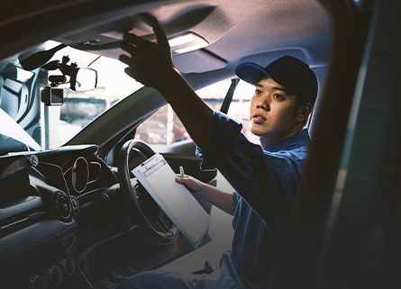 mechanic working on interior car maintenance